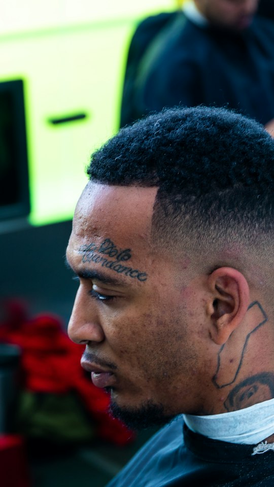 Side profile of a fresh skin fade with a razor line-up