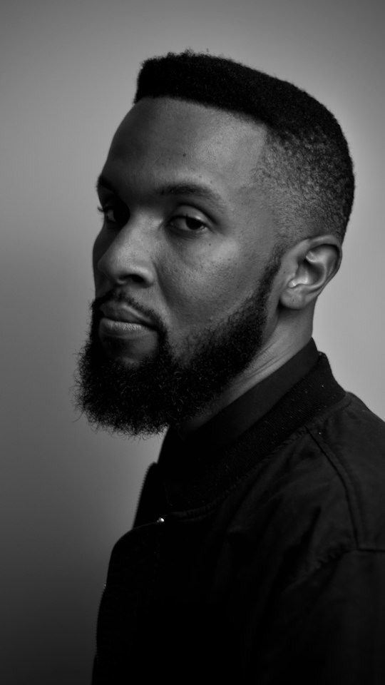 Black and white portrait of a sculpted full beard